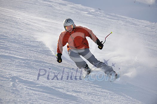 young athlete man have fun during skiing sport on hi mountain slopes at winter seasson and sunny day