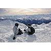 happy people group have fun on snow at winter season on mountain with blue sky and fresh air