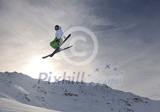 extreme freestyle ski jump with young man at mountain in snow park at winter season extreme freestyle ski jump with young man at mountain in snow park at winter season