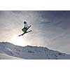 extreme freestyle ski jump with young man at mountain in snow park at winter season