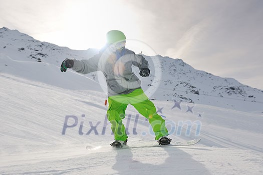 happy young man have fun at mountain peak on winter season with beautiful sunset happy young man have fun at mountain peak on winter season with beautiful sunset
