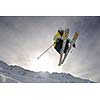 extreme freestyle ski jump with young man at mountain in snow park at winter season