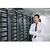 young handsome business man  engeneer in datacenter server room 