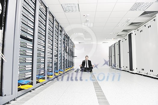 young handsome business man in black suit and tie practice yoga and relax at network server room while representing stres control concept young handsome business man in black suit and tie practice yoga and relax at network server room while representing stres control concept