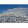 Ski lift gondola in Alps mountains at winter