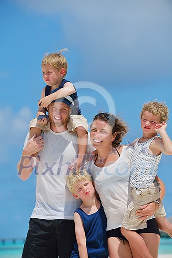 Portrait of a happy family on summer vacation at beach Portrait of a happy family on summer vacation at beach