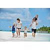 Portrait of a happy family on summer vacation  at beach