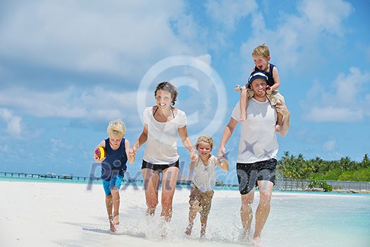 Portrait of a happy family on summer vacation at beach Portrait of a happy family on summer vacation at beach