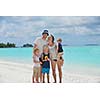 Portrait of a happy family on summer vacation  at beach