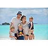 Portrait of a happy family on summer vacation  at beach