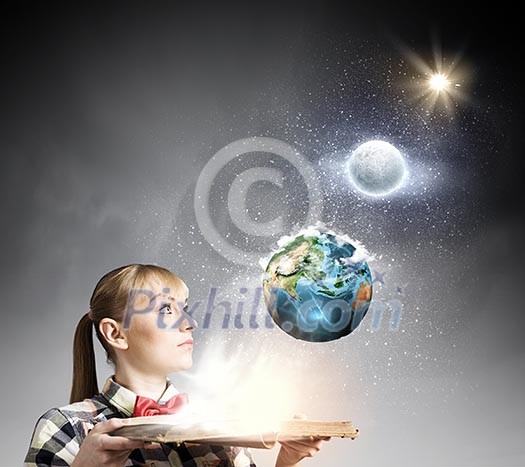 Woman in casual wear holding opened book in hands. elements of this image are furnished by NASA Woman in casual wear holding opened book in hands. elements of this image are furnished by NASA