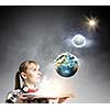 Woman in casual wear holding opened book in hands. elements of this image are furnished by NASA