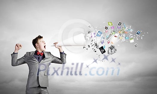 Young businessman speaking in trumpet and colorful icons flying out Young businessman speaking in trumpet and colorful icons flying out