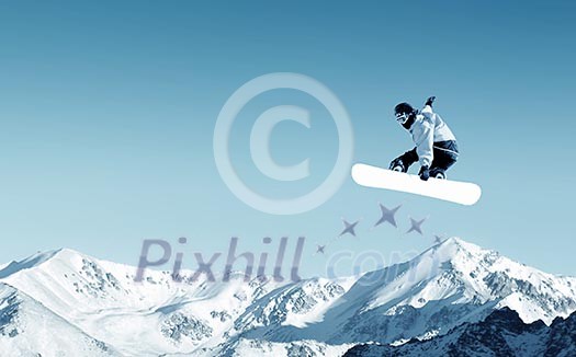 Snowboarder making jump high in clear sky Snowboarder making jump high in clear sky