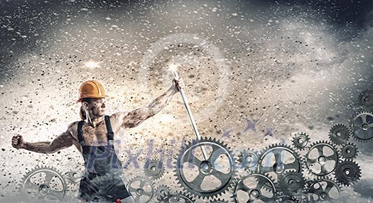 Strong man mechanic in uniform with spanner fixing mechanism Strong man mechanic in uniform with spanner fixing mechanism