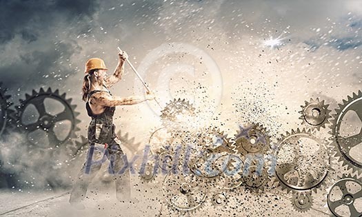 Strong man mechanic in uniform with spanner fixing mechanism Strong man mechanic in uniform with spanner fixing mechanism
