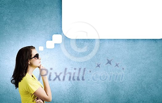 Young woman in casual with blank speech bubble above Young woman in casual with blank speech bubble above