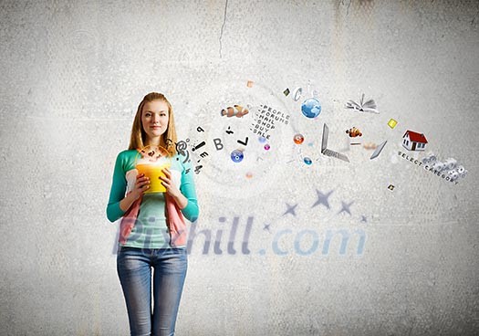 Young girl holding bucket with colorful splashes Young girl holding bucket with colorful splashes