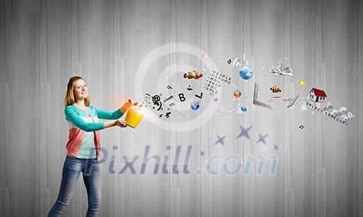 Young girl holding bucket with colorful splashes Young girl holding bucket with colorful splashes