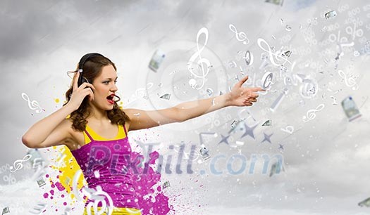 Image of young woman wearing headphones and singing Image of young woman wearing headphones and singing