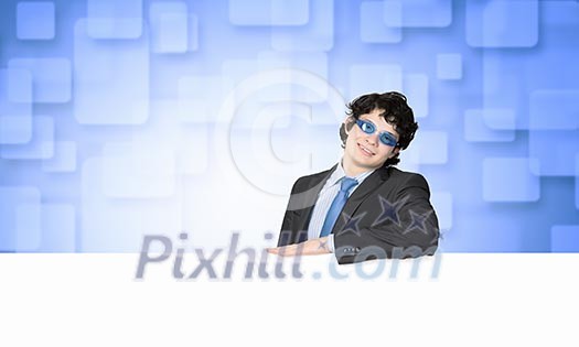 Image of businessman in goggles with blank white banner. Place for text Image of businessman in goggles with blank white banner. Place for text