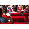 University students sitting in class, taking notes