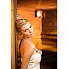 Young woman relaxing in a sauna, taking a break from her busy schedule, taking care of herself, enjoying the wellness benefits her job provides