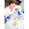 Portrait of a female researcher doing research in a lab (shallow DOF; color toned image)