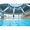 group of happy kids children   at swimming pool class  learning to swim