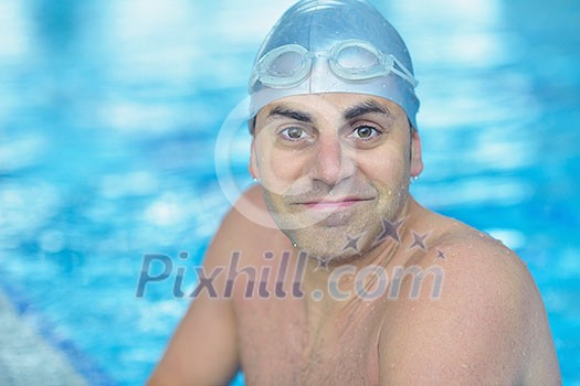 health and fitness lifestyle concept with young athlete swimmer recreating on indoor olimpic pool health and fitness lifestyle concept with young athlete swimmer recreating on indoor olimpic pool