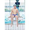 happy little child portrait on swimming school classes and recreation at indoor pool