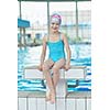 happy little child portrait on swimming school classes and recreation at indoor pool