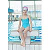 happy little child portrait on swimming school classes and recreation at indoor pool