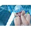 happy little child portrait on swimming school classes and recreation at indoor pool