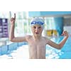 happy little child portrait on swimming school classes and recreation at indoor pool