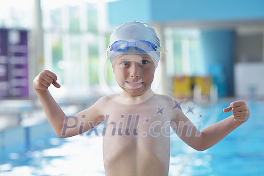 happy little child portrait on swimming school classes and recreation at indoor pool happy little child portrait on swimming school classes and recreation at indoor pool