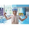 happy little child portrait on swimming school classes and recreation at indoor pool