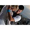 romantic urban couple dancing on top of the bulding 