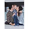 happy young family have fun and relaxing at new home with bright furniture