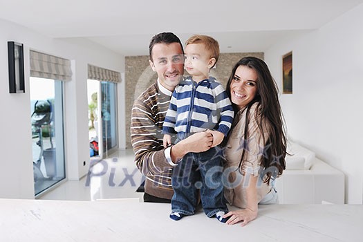 happy young family have fun and relaxing at new home with bright furniture happy young family have fun and relaxing at new home with bright furniture
