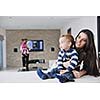 happy young family have fun and relaxing at new home with bright furniture