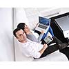 joyful couple relax and work on laptop computer at modern living room indoor home