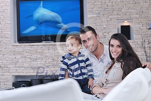 happy young family have fun and relaxing at new home with bright furniture happy young family have fun and relaxing at new home with bright furniture