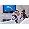happy young family have fun and relaxing at new home with bright furniture