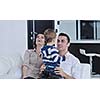 happy young family have fun and relaxing at new home with bright furniture