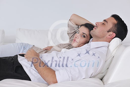 happy young couple relax at modern home living room indoor happy young couple relax at modern home living room indoor