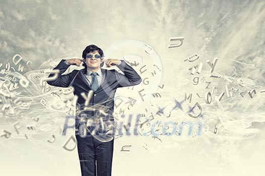 Image of businessman stopping his ears. Long working hours Image of businessman stopping his ears. Long working hours