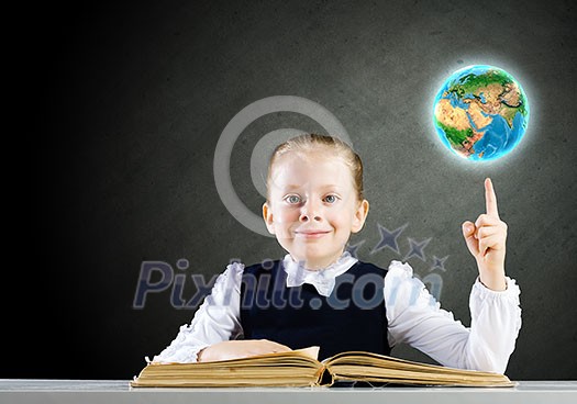 Schoolgirl looking in opened book with sketches at background. Elements of this image are furnished by NASA Schoolgirl looking in opened book with sketches at background. Elements of this image are furnished by NASA