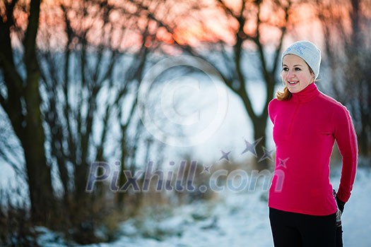 Winter running - Young woman running outdoors on a cold winter day