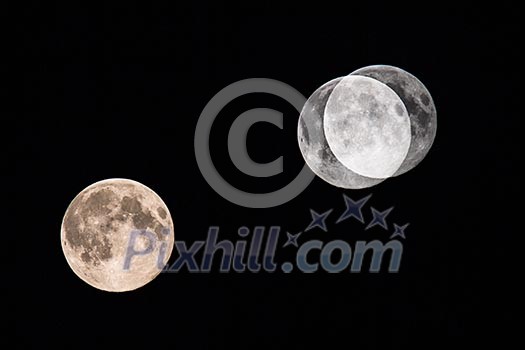 Big moon on dark night sky (multiple exposure showing the progression of the moon through the sky) Big moon on dark night sky (multiple exposure showing the progression of the moon through the sky)